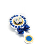 Blue baby Boy shower rattle centerpiece with white baby shoes and gold glitter details