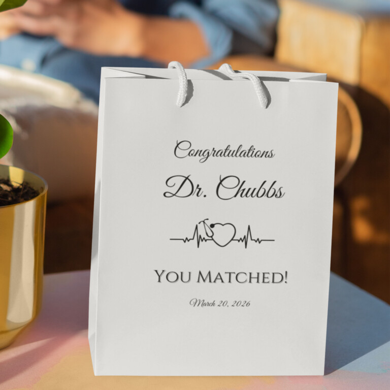 Personalized doctor Match Day gift bag with Congratulations Dr. Chubbs You Matched message and heartbeat medical symbol, white residency match celebration gift bag