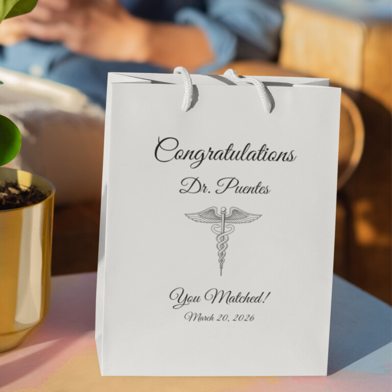 Personalized doctor Match Day gift bag with Congratulations Dr. Puentes You Matched message and medical caduceus symbol, white graduation gift bag for residency Match Day celebration
