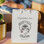 Officially RN graduation gift bag personalized with name Sara and graduation date, Registered Nurse gift bag with stethoscope heart design