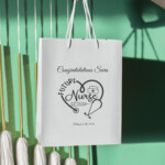 Personalized Future Nurse Graduation Gift Bag with name Sara and graduation date, white gift bag with rope handles for nursing school graduation gift