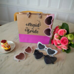 Personalized Maid of Bride gift bag with heart sunglasses .