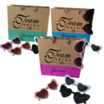 Personalized Team Bride gift bags with heart sunglasses in pink, blue, and green colors for bridal parties, wedding weekends, and bachelorette celebrations.