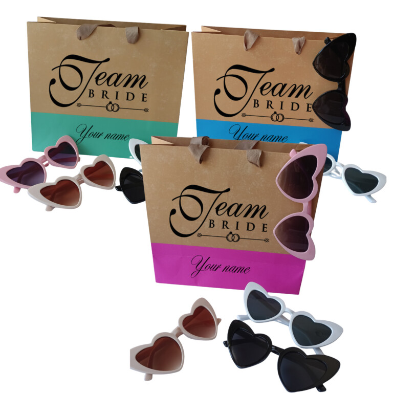 Personalized Team Bride gift bags with heart sunglasses in pink, blue, and green colors for bridal parties, wedding weekends, and bachelorette celebrations.