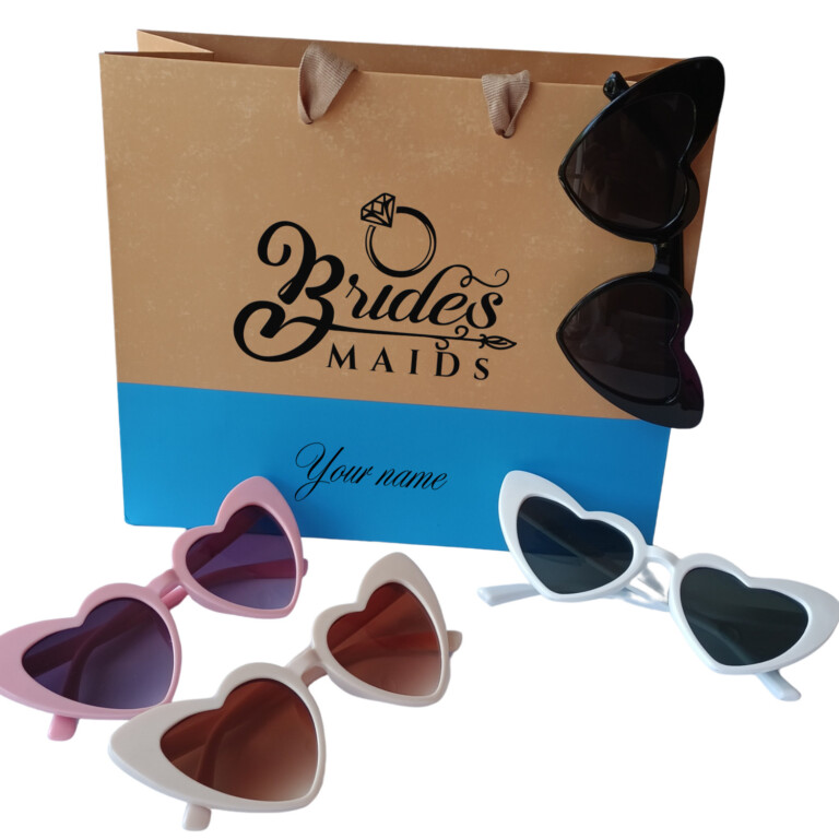 Blue bridal party gift bags with heart sunglasses personalized for bridesmaids and wedding celebrations.