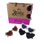Blue bridal party gift bags with heart sunglasses personalized for bridesmaids and wedding celebrations.